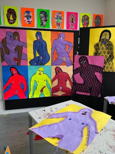 Christopher Kane's artworks of naked people displayed on a wall 