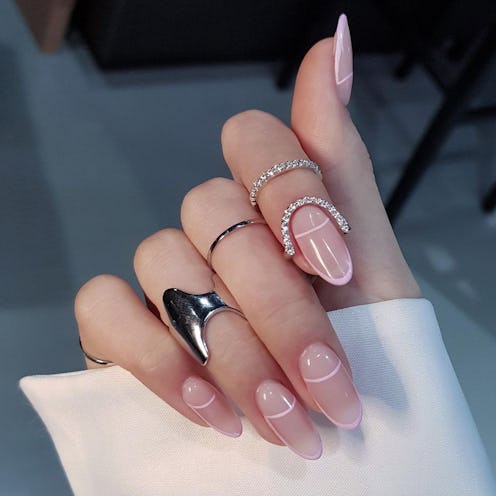 Fine line manicure with rings