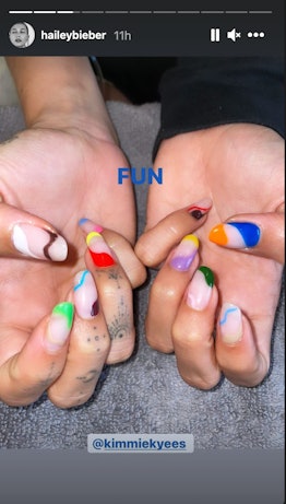 Hailey Bieber's nail art featured every color under the sun. It's part French manicure, part modern ...
