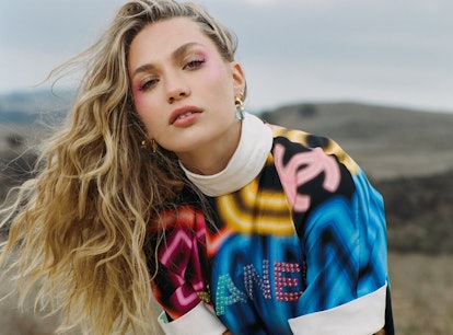 Maddie Ziegler posing in a landscape wearing bold-printed Chanel clothing for Elite Daily's BFF Issu...