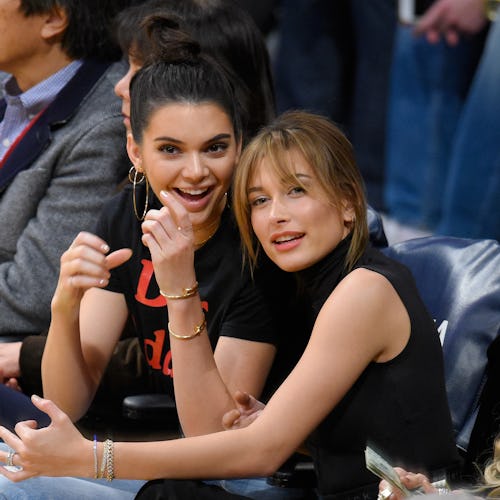 Best friends Kendall Jenner and Hailey Bieber attend a basketball game together.