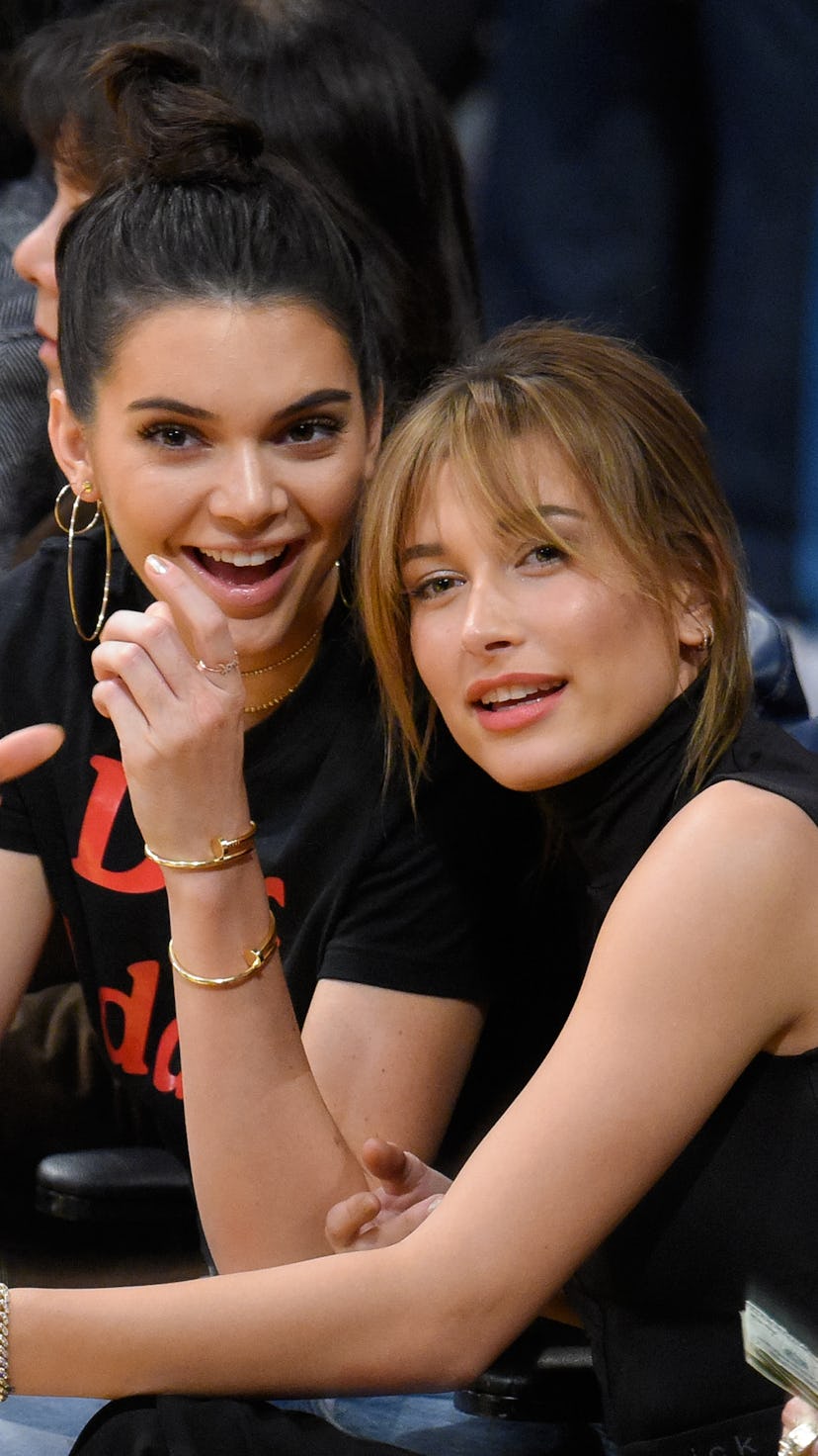 Best friends Kendall Jenner and Hailey Bieber attend a basketball game together.