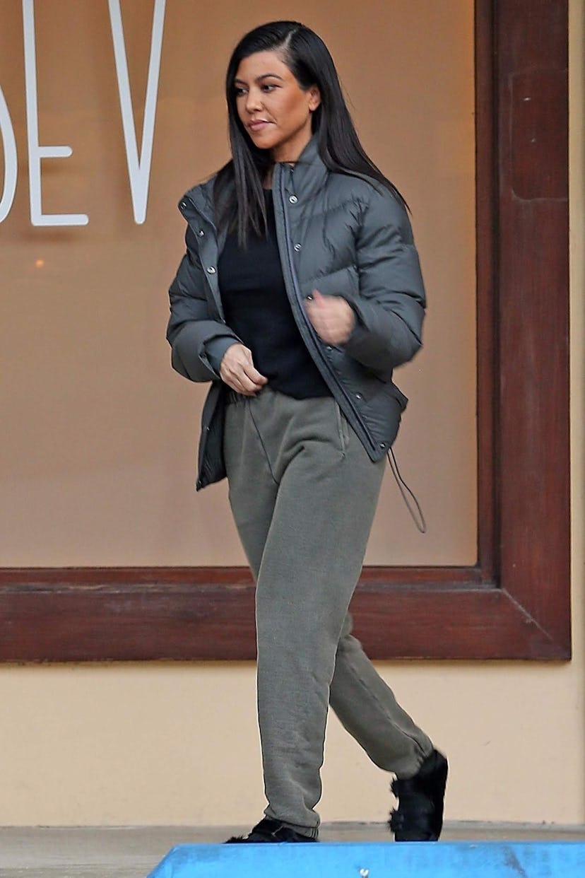 Kourtney Kardashian wears sweatpants and birkenstocks.