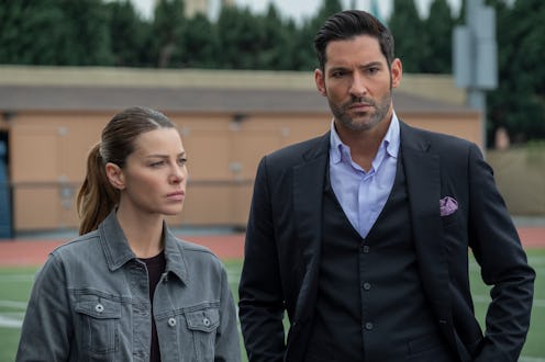 Chloe Decker (Lauren German) and Lucifer Morningstar (Tom Ellis) stand next to each other, looking s...