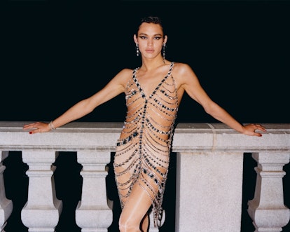 Charlie Nishimura in a sheer dress with bedazzled stripes accentuating the silhouette