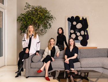 Tealia Ellis Ritter, Crystal Ellis, Stephanie Beamer and Hillary Petrie posing on a grey couch