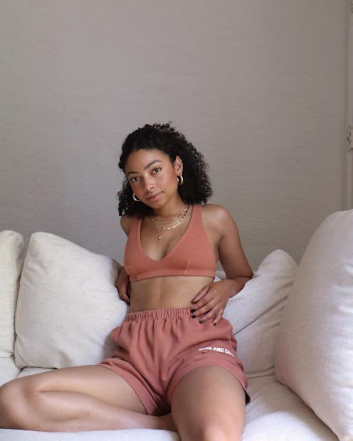 Influencer Natacha John wearing summer-appropriate lounge shorts from SALT SURF.