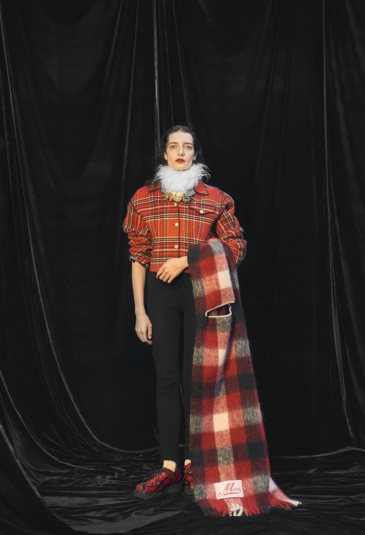 A model posing in a deconstructed suit from Marni's Pre-Fall 2021 collection