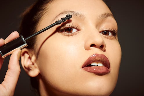 woman applying mascara