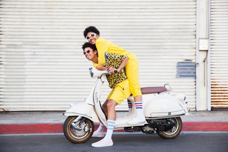Young woman spoiled by her boyfriend on scooter, per her zodiac sign