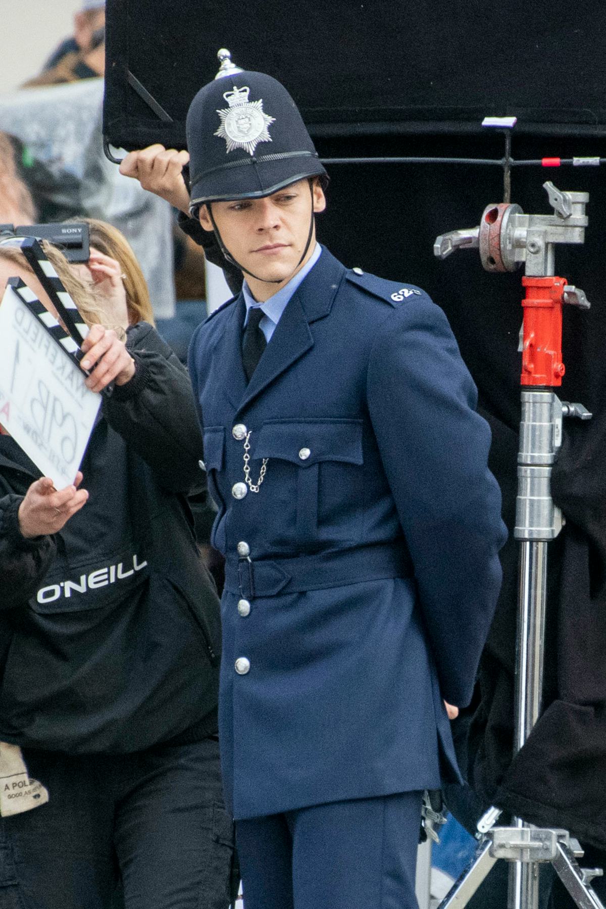 Harry Styles dressed as a cop