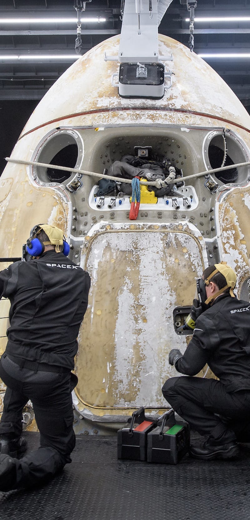 Crew-1 Dragon being pulled from the ocean