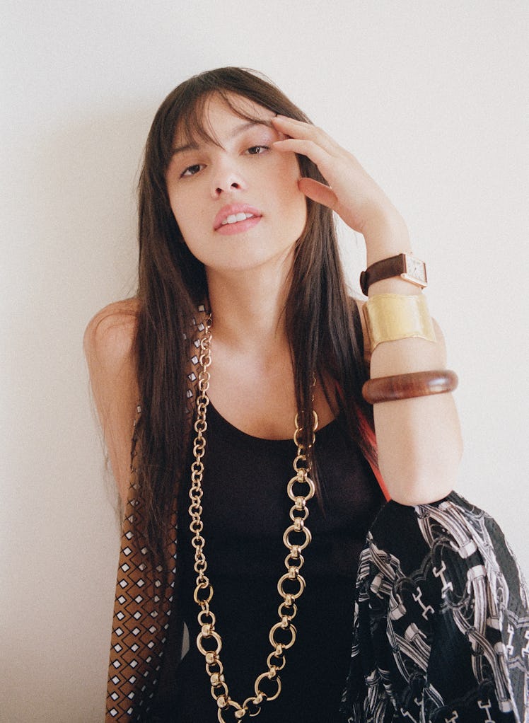 Olivia Rodrigo in an Hermès dress and pants; Laura Lombardi belt, worn as necklace; Cartier watch; s...
