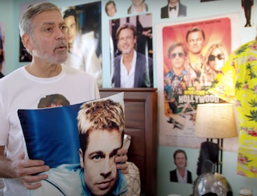 George Clooney holding pillow of Brad Pitt