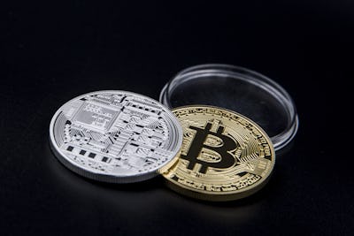 Silver and golden Bitcoin coins