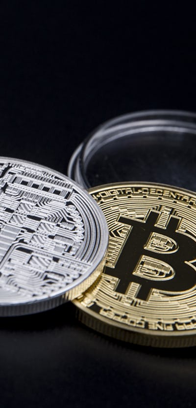 Silver and golden Bitcoin coins