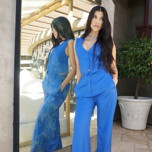 Kourtney Kardashian in a blue two-piece set.