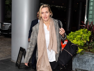 Kate Winslet walking in Philly, wearing a tan scarf