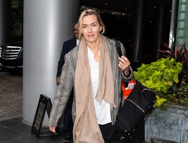 Kate Winslet walking in Philly, wearing a tan scarf