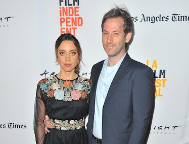 Aubrey Plaza in a floral dress, Jeff Baena in a suit