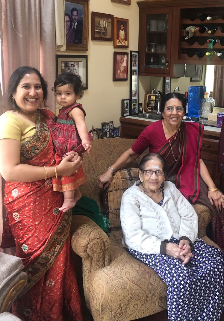 The author wears a sari, holding her toddler daughter. Her mother and grandmother are both pictured ...