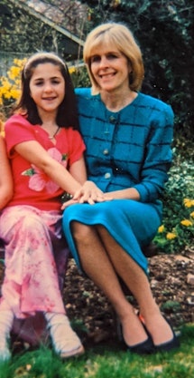 The author as a little girl, with her mom in a blue skirt suit.