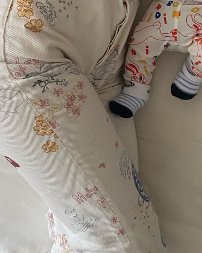 Emily Ratajkowski and her son in matching doodle outfits.