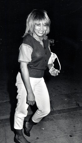 '90s fashion: Tina Turner's street style often included sweater vests. 