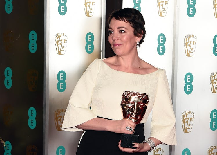Olivia Colman holding a BAFTA