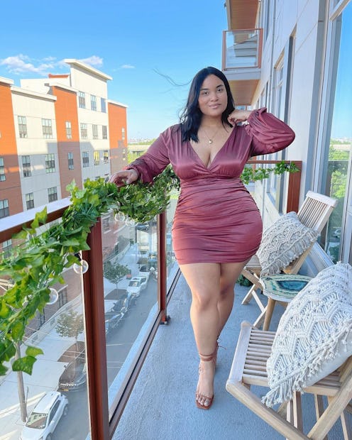 Fashion TikToker and influencer Denise Mercedes poses in a pink dress.