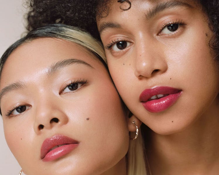 Two Ilia beauty models in tinted lip balm for 10th anniversary