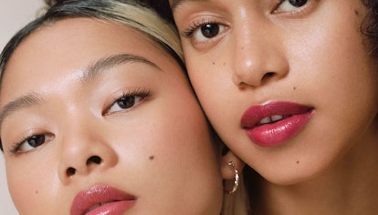 Two Ilia beauty models in tinted lip balm for 10th anniversary