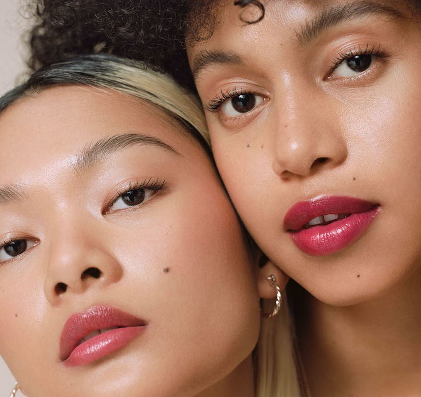 Two Ilia beauty models in tinted lip balm for 10th anniversary