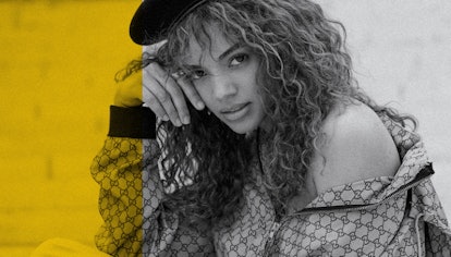 Full-profiled Leslie Grace posing with her curly hairstyle