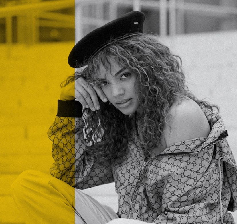 Full-profiled Leslie Grace posing with her curly hairstyle