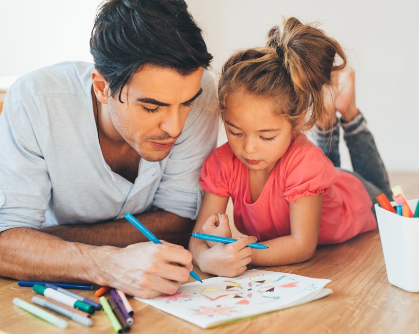 father and daughter coloring together