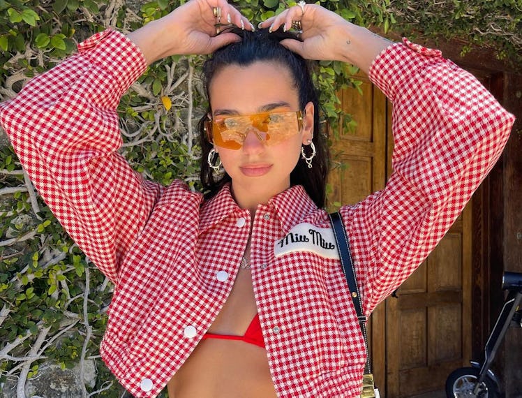 Dua Lipa dressed as a cowgirl.