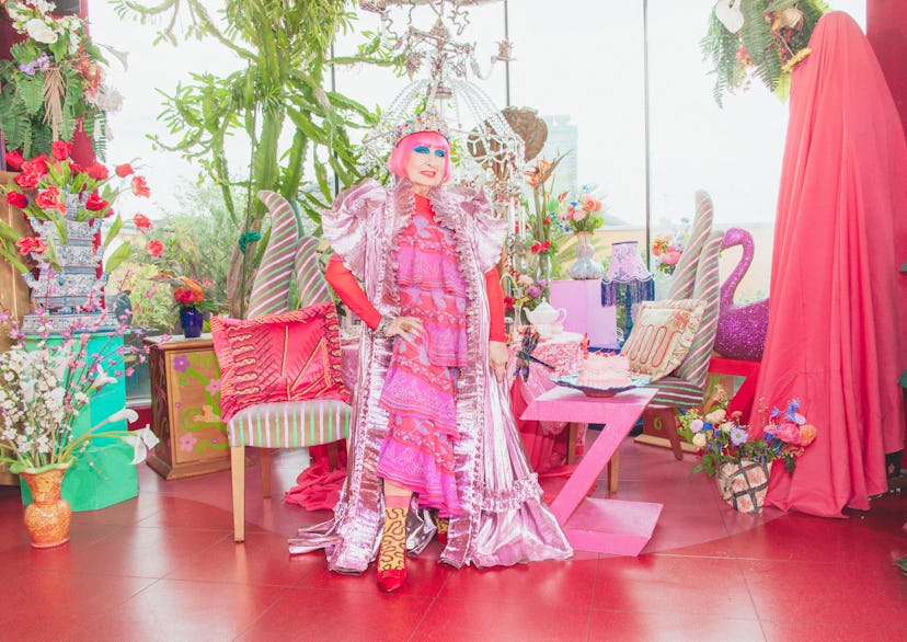 Dame Zandra Rhodes inside her London Penthouse with unique furniture pieces and flowers mostly in pi...