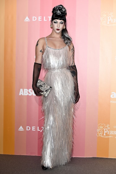 Violet Chachki in pin-up style in a long pearl shiny fringed dress at the amfAR gala