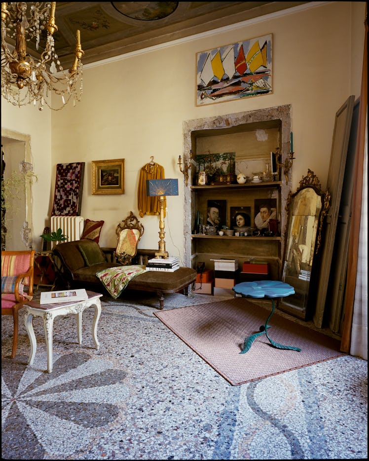 a living room in Rome filled with art and antiques