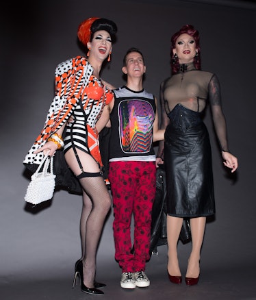 Violet Chachki in pin-up style in a black-white-orange dress and jacket next to Marc Jacobs at his s...