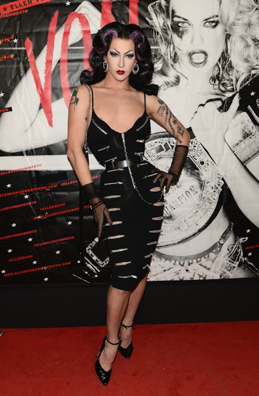 Violet Chachki in pin-up style in a black dress with zippers at the Von magazine launch