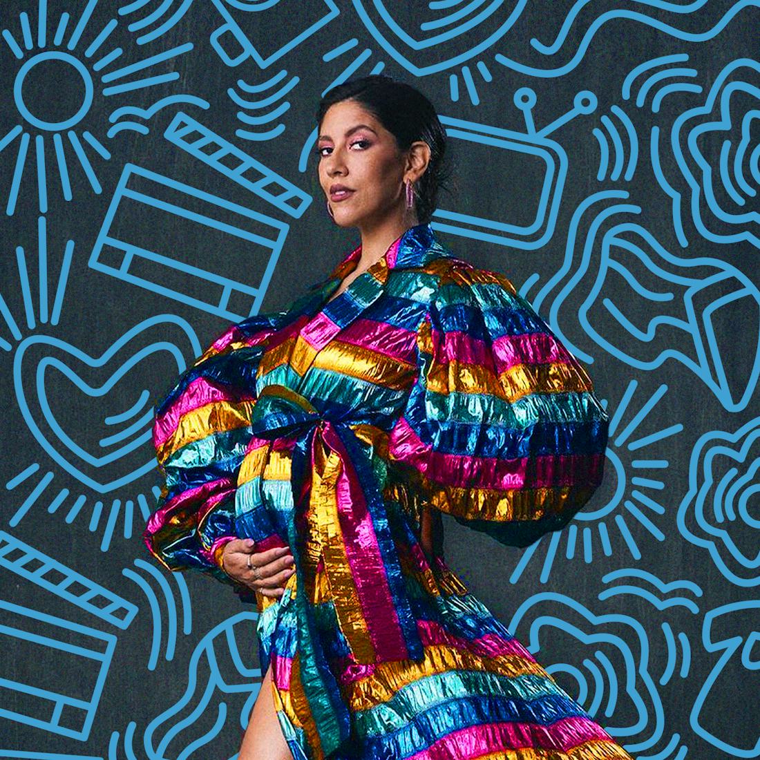 Stephanie Beatriz in a rainbow colored dress