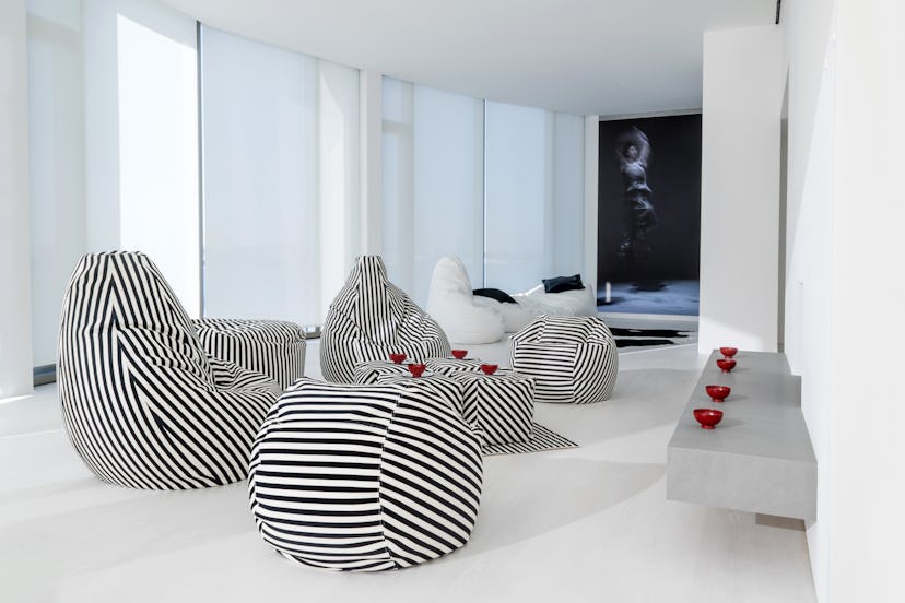 Norma Kamali's minimalist home decor collection includes cozy lounge pieces.