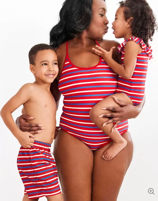4th of July bathing suits for the family; mom, daughter, and son in matching 4th of July swimsuits