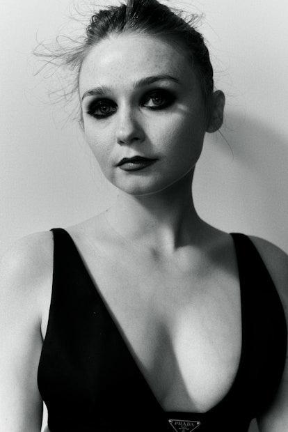 A portrait of Jessica Barden in a tank top in black-and-white