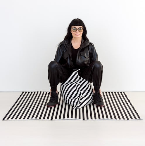 Norma Kamali designed a home collection that includes a black and white, oversized pillow.
