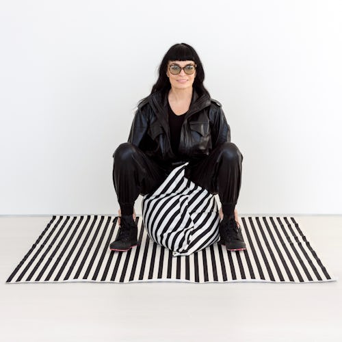 Norma Kamali designed a home collection that includes a black and white, oversized pillow.