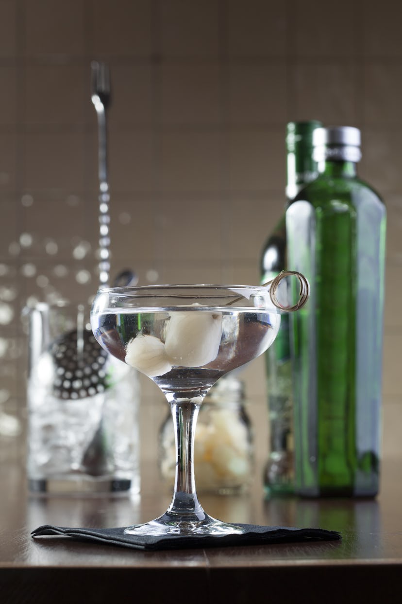 A Gibson martini is garnished with pickled pearl onions. 