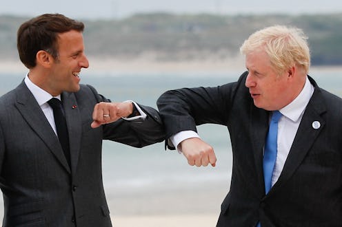 Britain's Prime Minister Boris Johnson (R) greets France's President Emmanuel Macron during the G7 ...